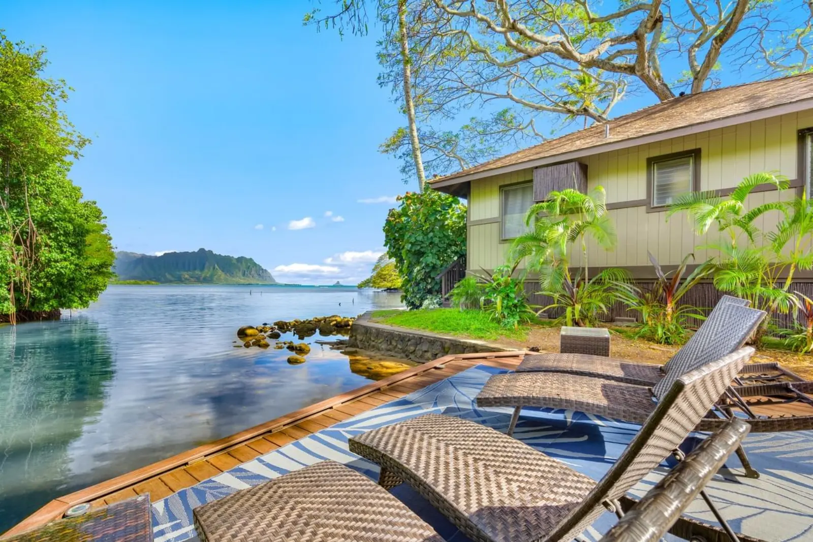 Waterfront cottages and lounge deck at Paradise Bay Resort